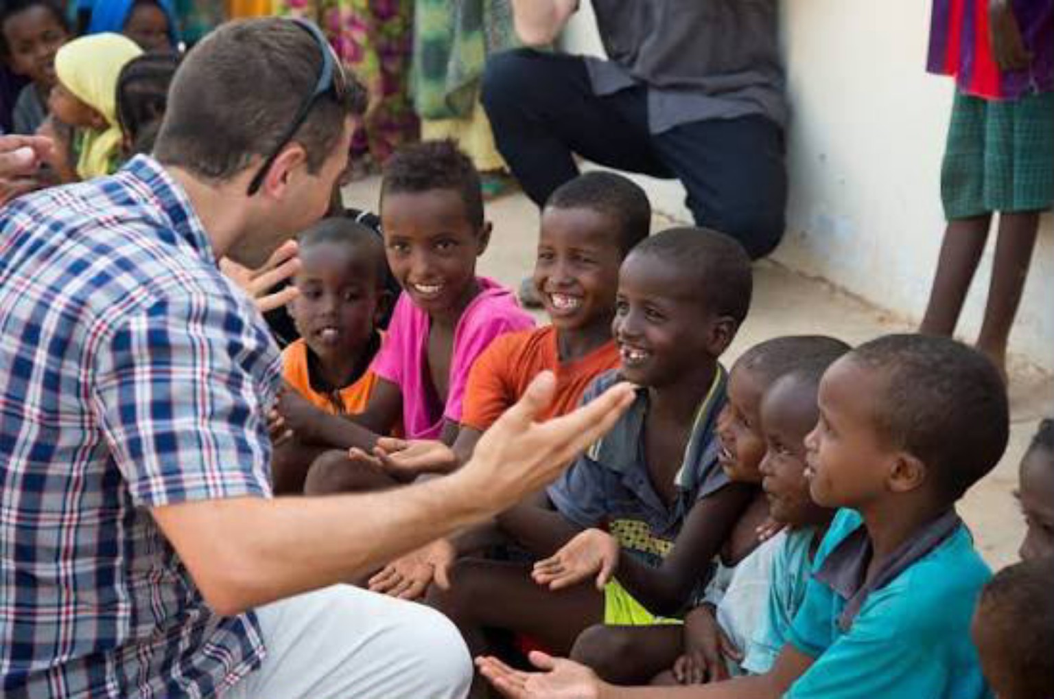 Volunteer engaging with children